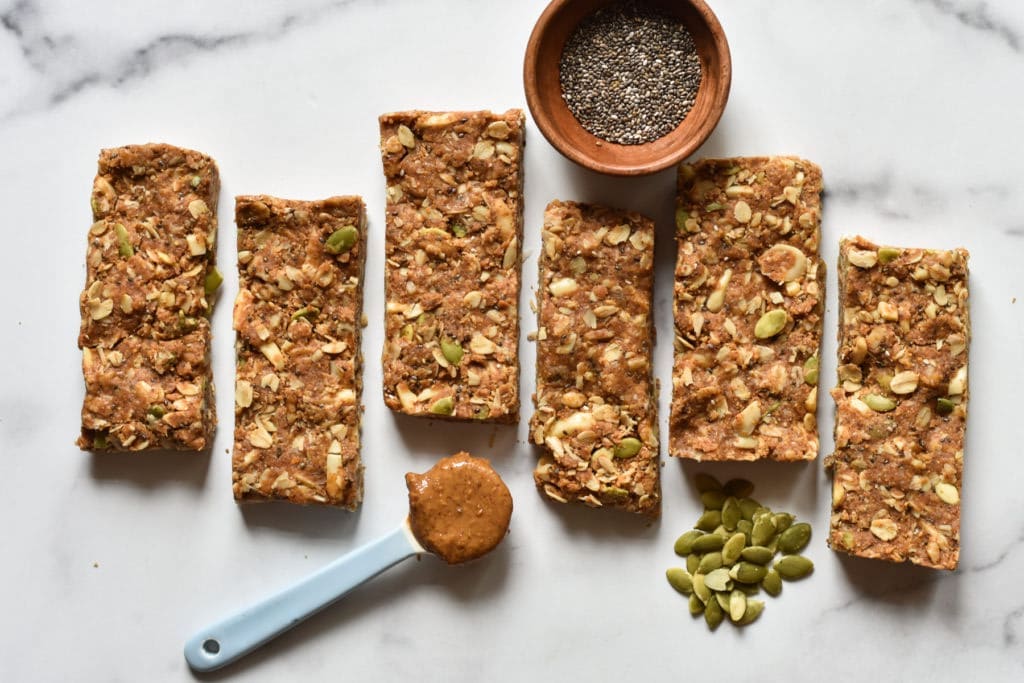 Homemade oatmeal energy bars with nuts and dried fruit on parchment paper
