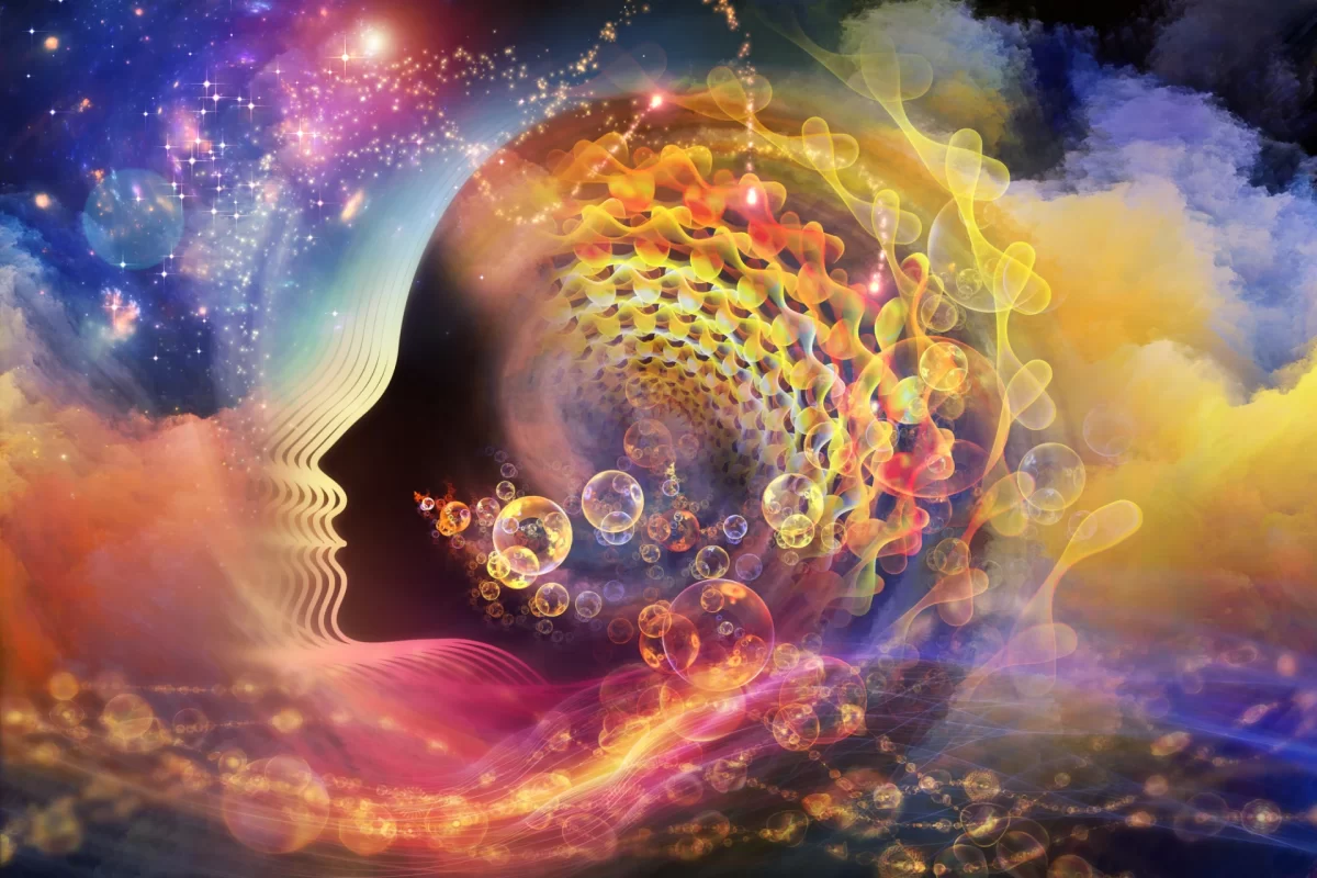 Abstract visualization of consciousness showing a human head merging with neural networks and cosmic energy patterns.
