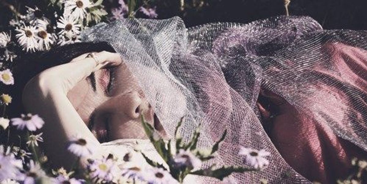 Close-up of psilocybin mushrooms in atmospheric lighting, representing the connection between magic mushrooms, dreaming, and altered states of consciousness.